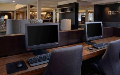 Business center with computers, printer and ergonomic chair at Sonesta Select Kansas City South Overland Park.