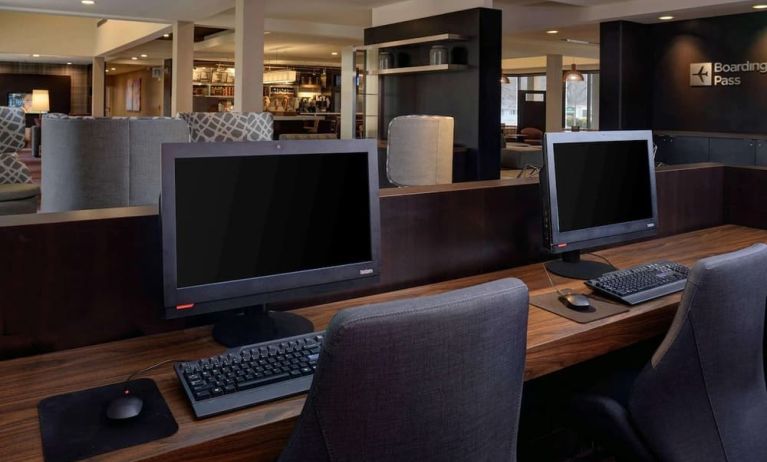 Business center with computers, printer and ergonomic chair at Sonesta Select Kansas City South Overland Park.