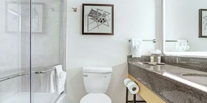 Guest bathroom with shower at Hilton Crystal City At Washington Reagan National Airport.