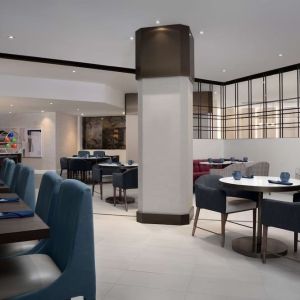 Dining area perfect for coworking at Hilton Crystal City At Washington Reagan National Airport.