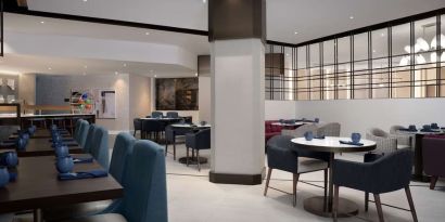 Dining area perfect for coworking at Hilton Crystal City At Washington Reagan National Airport.