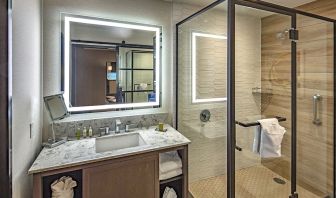 Guest bathroom with shower at DoubleTree By Hilton Modesto.