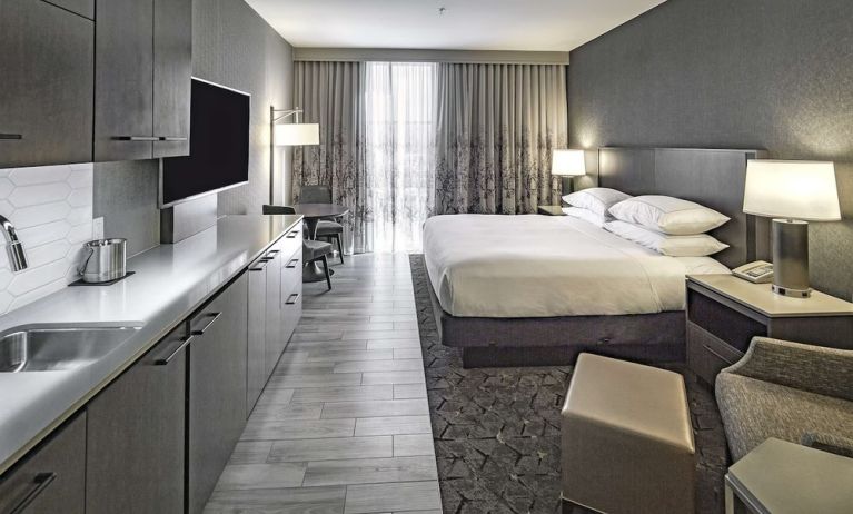 Day use room with mini kitchen and TV at DoubleTree By Hilton Modesto.