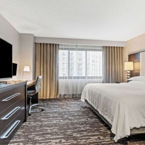 Day use room with natural light and work desk at Embassy Suites By Hilton Crystal City-National Airport.