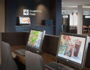 Business center with computers and ergonomic chairs at Sonesta Select Whippany Hanover.
