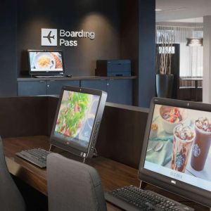 Business center with computers and ergonomic chairs at Sonesta Select Whippany Hanover.