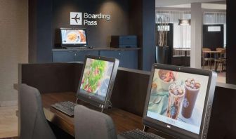Business center with computers and ergonomic chairs at Sonesta Select Whippany Hanover.
