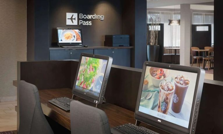 Business center with computers and ergonomic chairs at Sonesta Select Whippany Hanover.
