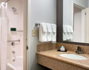 Private guest bathroom with combined shower and tub at Sonesta Select Whippany Hanover.
