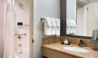 Private guest bathroom with combined shower and tub at Sonesta Select Whippany Hanover.