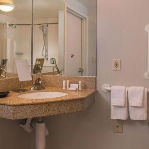 Private guest bathroom with shower and free toiletries at Sonesta Select Columbia.
