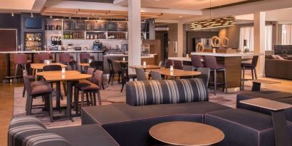 Dining area with comfortable seating, perfect for coworking at Sonesta Select Columbia.