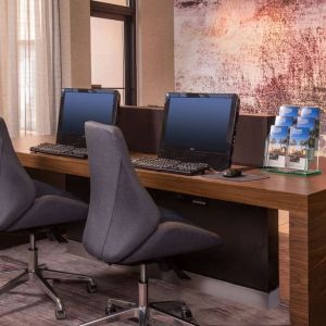 Business center with computers, printer and ergonomic chairs at Sonesta Select Columbia.