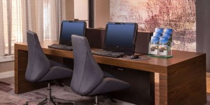 Business center with computers, printer and ergonomic chairs at Sonesta Select Columbia.