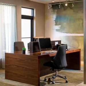 Business center with computers, printer and ergonomic chairs at Sonesta Select Boca Raton.