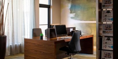 Business center with computers, printer and ergonomic chairs at Sonesta Select Boca Raton.
