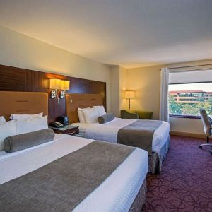 Bright and spacious day use twin room with work desk at Sonesta Milwaukee West Wauwatosa.