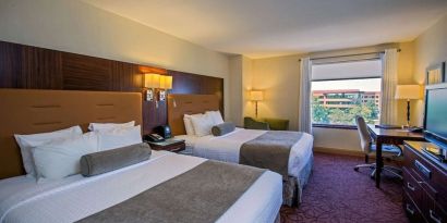 Bright and spacious day use twin room with work desk at Sonesta Milwaukee West Wauwatosa.