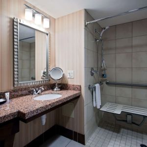Private guest bathroom with shower at Sonesta Milwaukee West Wauwatosa.