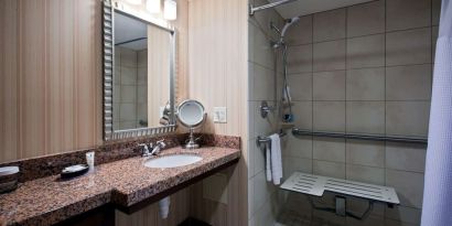 Private guest bathroom with shower at Sonesta Milwaukee West Wauwatosa.