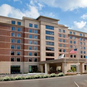 Hotel exterior and parking area at Sonesta Milwaukee West Wauwatosa.