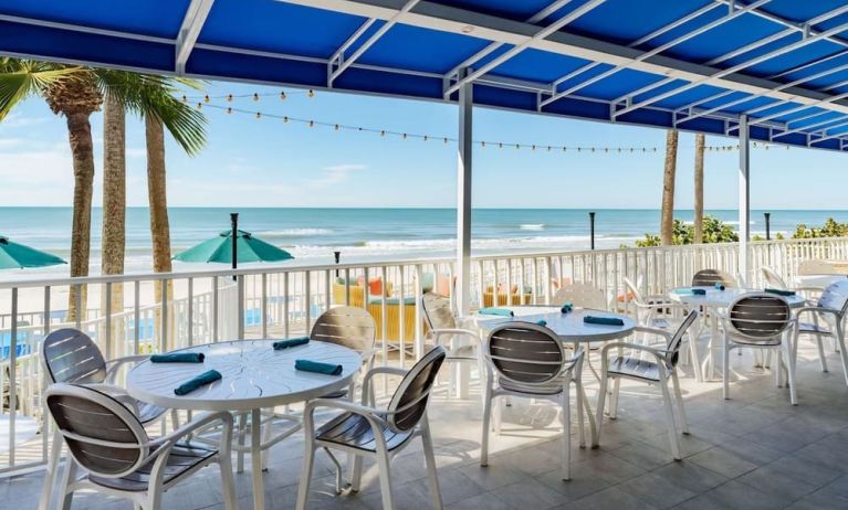 Alfresco dining with a view of the beach at DoubleTree Beach Resort By Hilton Tampa Bay - North Redington.