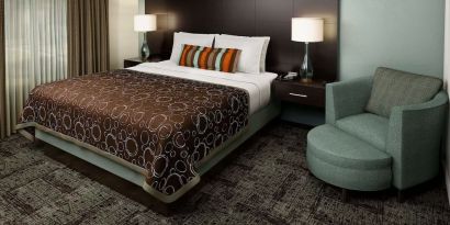 Bright and spacious day use room with sofa at Sonesta ES Suites Dallas Las Colinas.