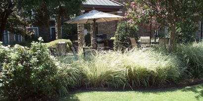 Patio with lounge seating at Sonesta ES Suites Dallas Las Colinas.