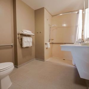 Private guest bathroom with shower at Sonesta ES Suites Dallas Las Colinas.
