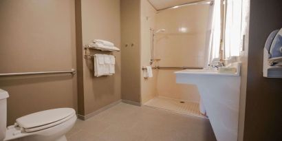 Private guest bathroom with shower at Sonesta ES Suites Dallas Las Colinas.