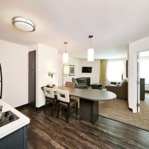 Day use suite with in-room kitchen, living area and private bathroom at Sonesta Simply Suites Plano Frisco.