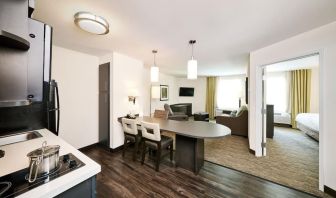 Day use suite with in-room kitchen, living area and private bathroom at Sonesta Simply Suites Plano Frisco.
