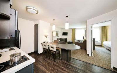 Day use suite with in-room kitchen, living area and private bathroom at Sonesta Simply Suites Plano Frisco.