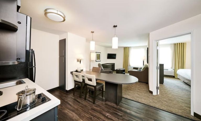 Day use suite with in-room kitchen, living area and private bathroom at Sonesta Simply Suites Plano Frisco.