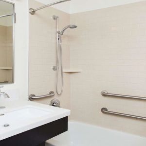 Private guest bathroom with shower at Sonesta Simply Suites Plano Frisco.