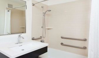 Private guest bathroom with shower at Sonesta Simply Suites Plano Frisco.