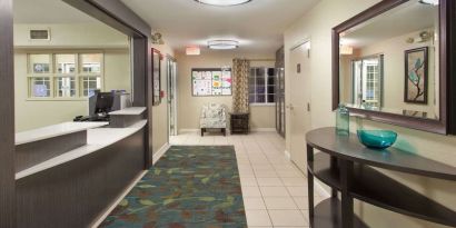 Hotel reception at Sonesta Simply Suites Dallas Las Colinas.