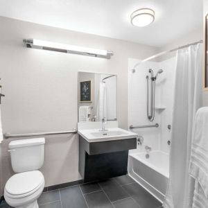 Private guest bathroom at Sonesta Simply Suites Austin South.