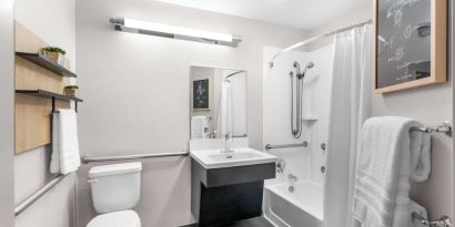 Private guest bathroom at Sonesta Simply Suites Austin South.