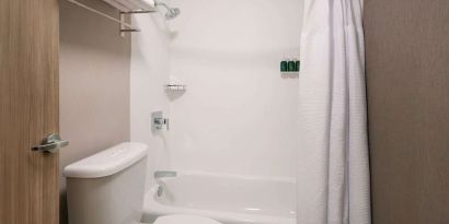 Private guest bathroom with shower at Sonesta Select Seattle Renton.