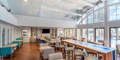 Dining area perfect for coworking at Hampton Inn & Suites Amelia Island-Historic Harbor Front.
