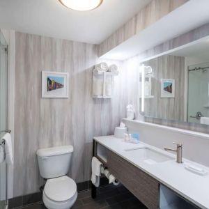 Guest bathroom with shower at Hampton Inn & Suites Amelia Island-Historic Harbor Front.