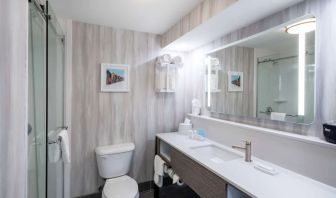 Guest bathroom with shower at Hampton Inn & Suites Amelia Island-Historic Harbor Front.