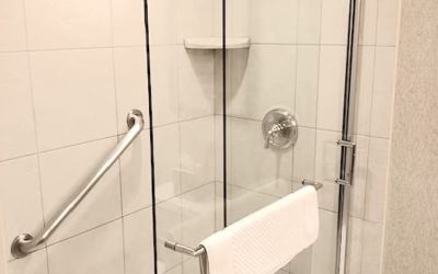 Guest bathroom with shower at DoubleTree By Hilton Lisle-Naperville.