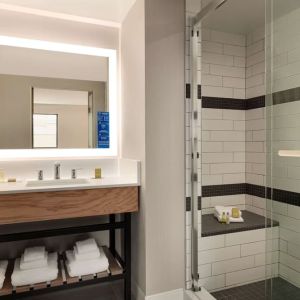 Guest bathroom with shower at DoubleTree By Hilton Canton Downtown.