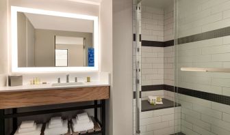 Guest bathroom with shower at DoubleTree By Hilton Canton Downtown.