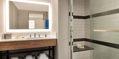Guest bathroom with shower at DoubleTree By Hilton Canton Downtown.