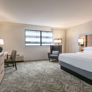 Spacious king size bed, TV and desk in a day use room at DoubleTree By Hilton Canton Downtown.