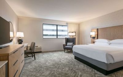 Spacious king size bed, TV and desk in a day use room at DoubleTree By Hilton Canton Downtown.