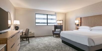 Spacious king size bed, TV and desk in a day use room at DoubleTree By Hilton Canton Downtown.